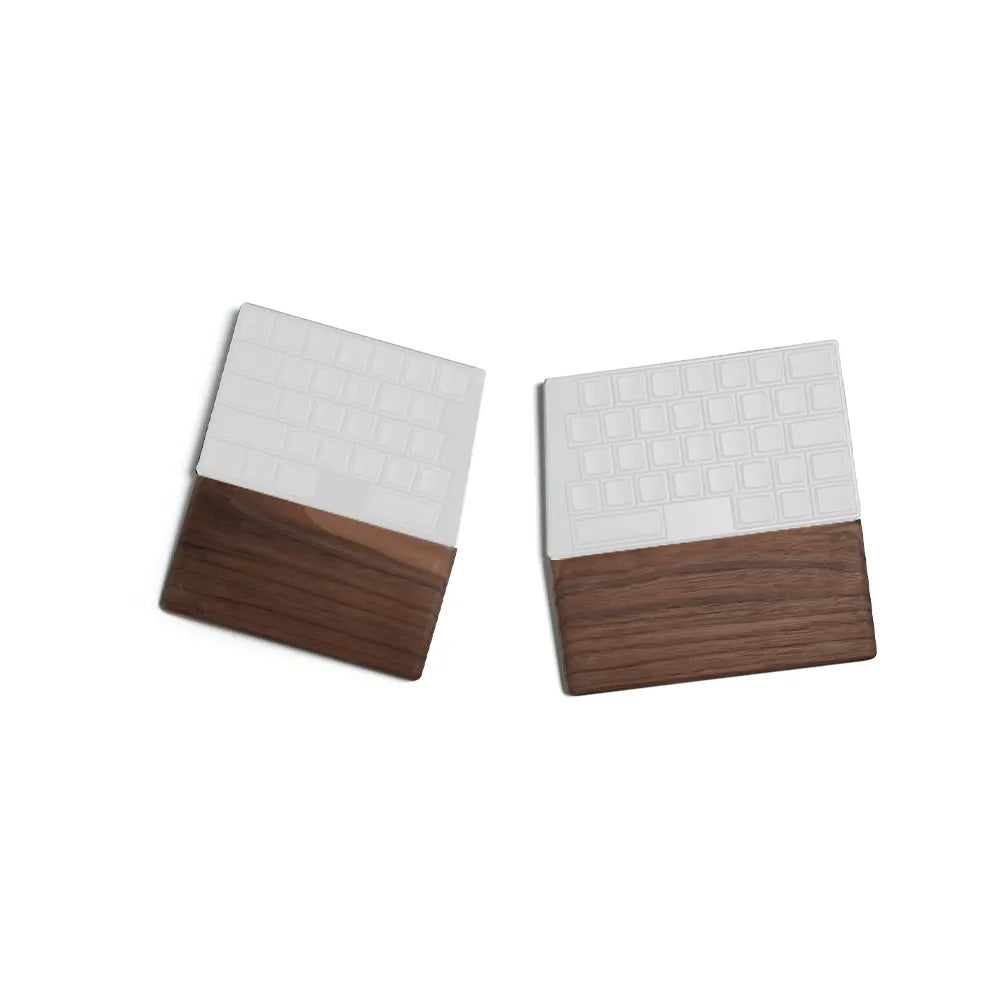 A premium studio photograph of the ElimKeys Elytra split mechanical keyboard with white keycaps and integrated dark walnut wood wrist rests, presented in a split ergonomic layout on a white background.