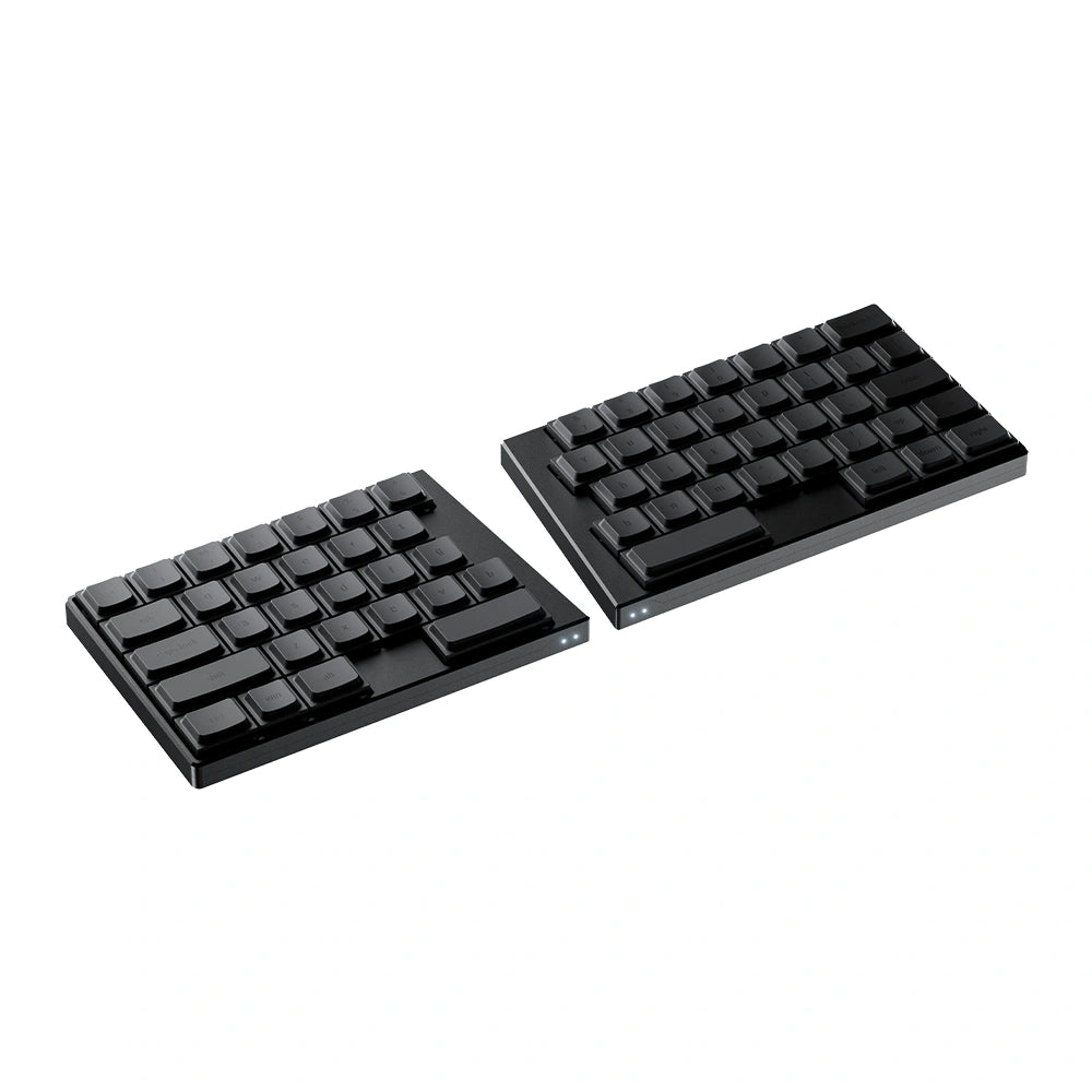 Angled studio shot of the black ElimKeys Elytra split mechanical keyboard, featuring blank low-profile keycaps separated on a pure white background.
