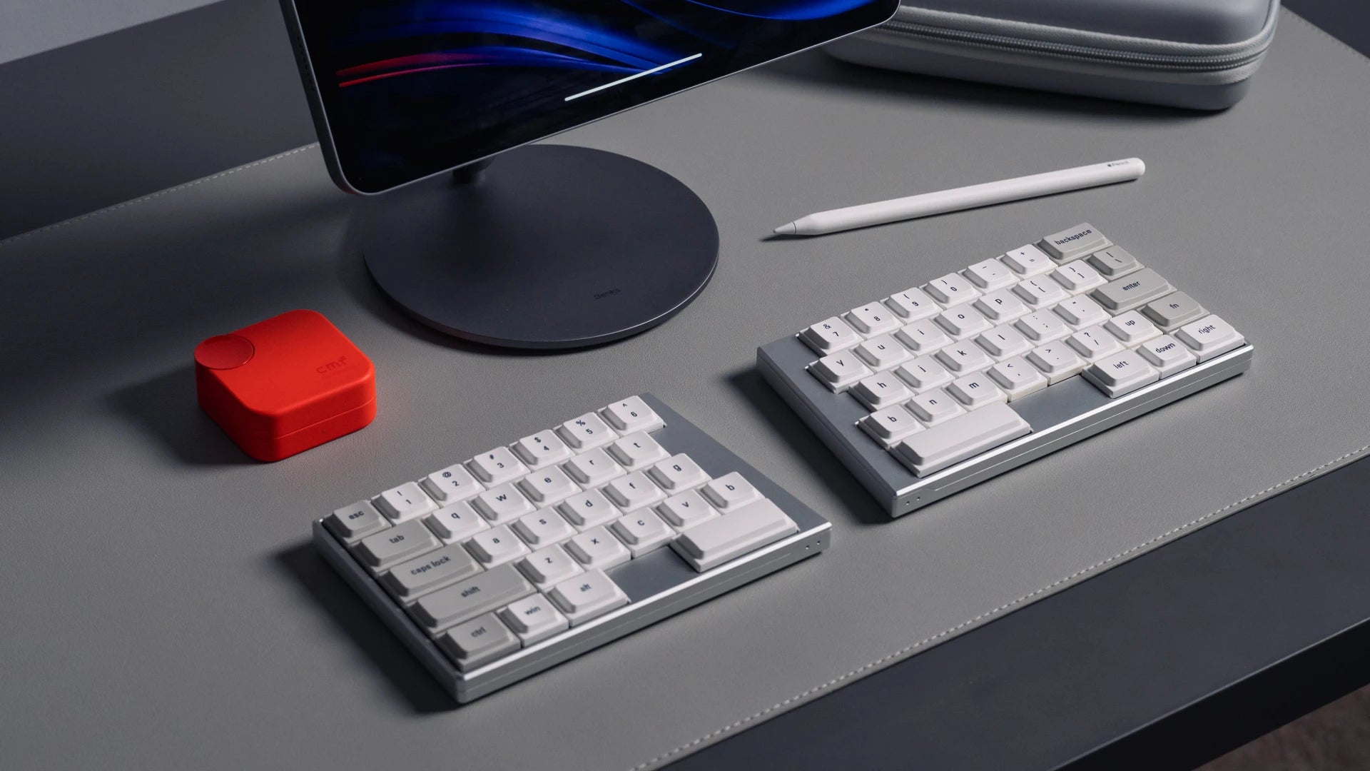 Side profile of ultralight split keyboard next to a tablet